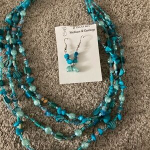 Teal colored necklace with matching earrings